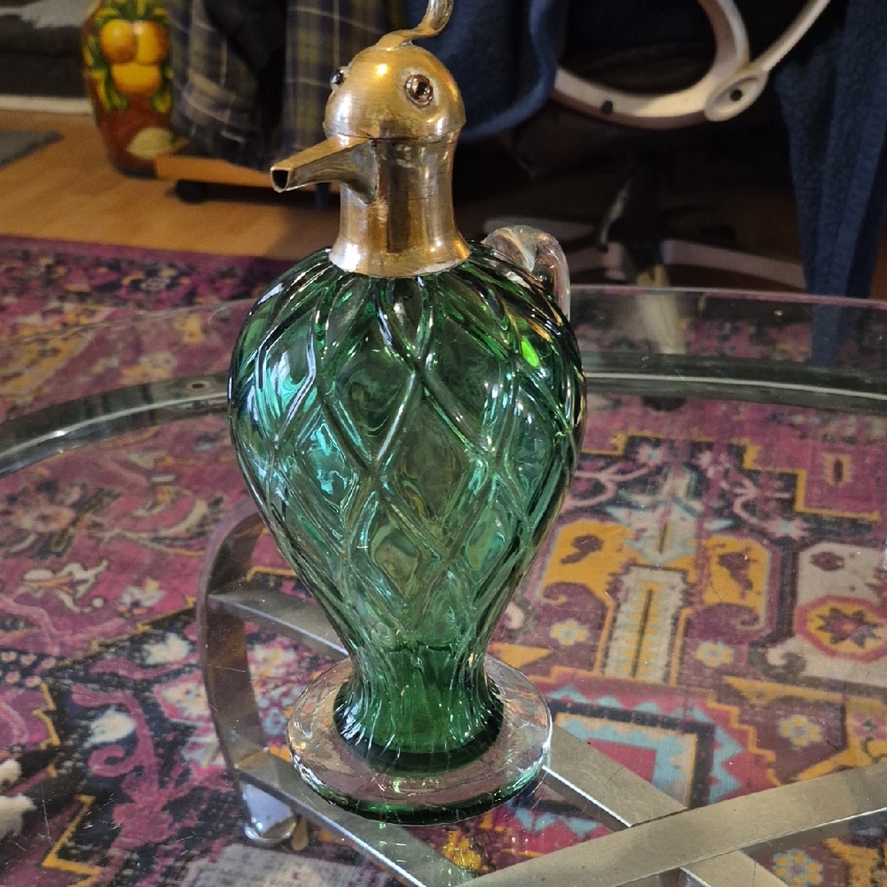 This unique item Is an antique bird-form wine decanter or claret jug